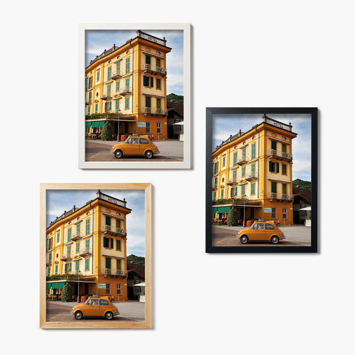 Three framed glass prints of a yellow hotel with green shutters and a matching yellow vintage car in front.
