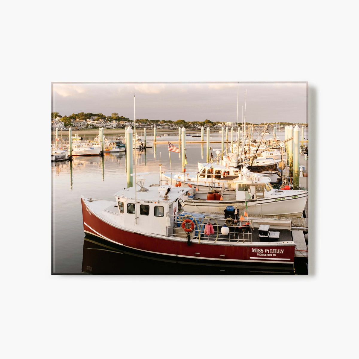 Glass print of a marina scene with boats docked at a harbor during sunset.