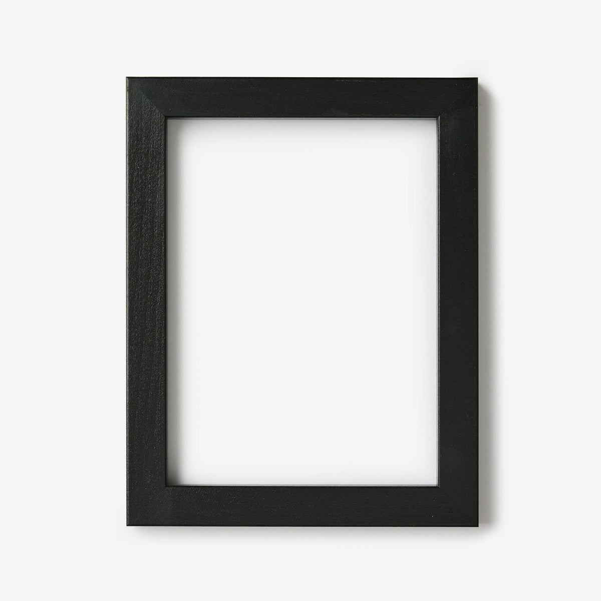 A small rectangular black wood frame on a white background